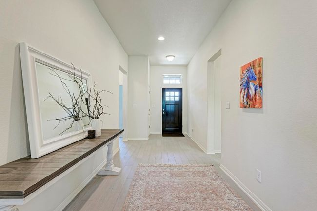 A wide, welcoming foyer can be adorned with your carefully curated furniture, transitioning from functional storage to an inviting display area. | Image 4