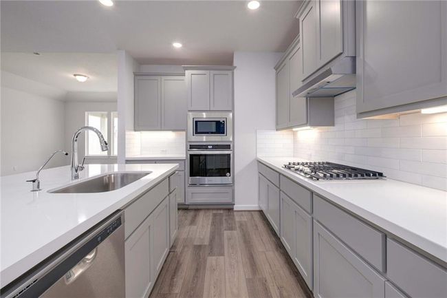 Kitchen with huge island and bar sitting area | Image 8