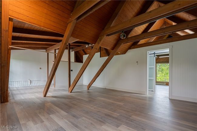 Spare room featuring wooden ceiling and wood finished floors | Image 26