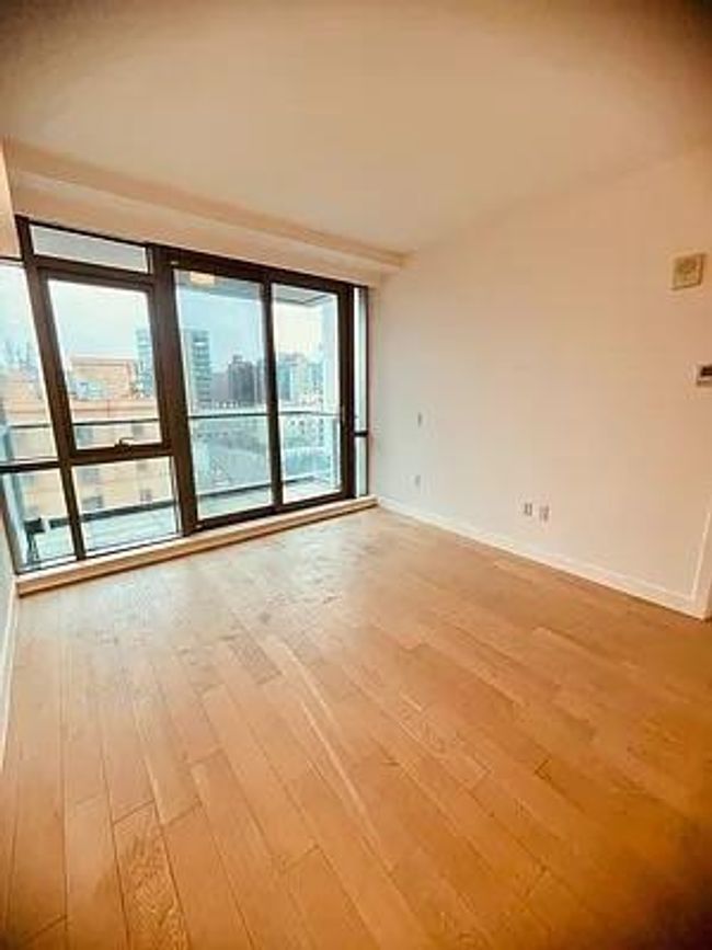 Unfurnished room with light wood-style floors and baseboards | Image 10
