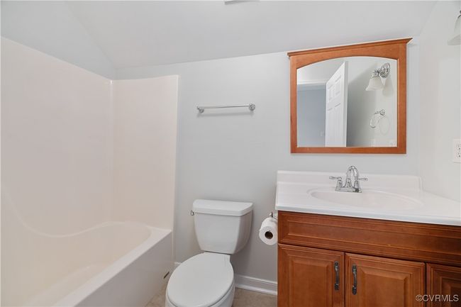 Full bath on 3rd floor vaulted ceiling, toilet, and vanity | Image 42