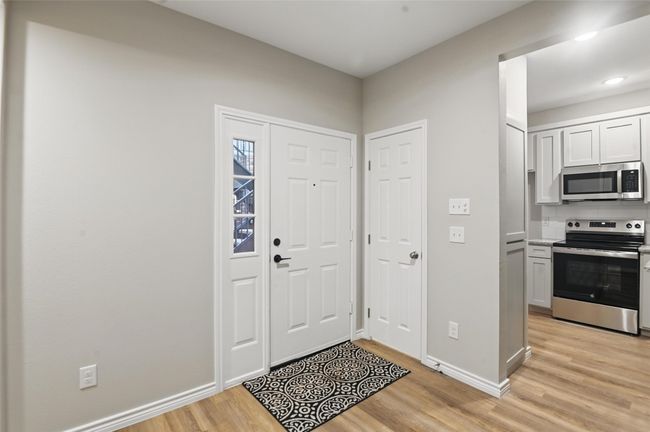 Entrance foyer with baseboards and light wood-style floors | Image 5
