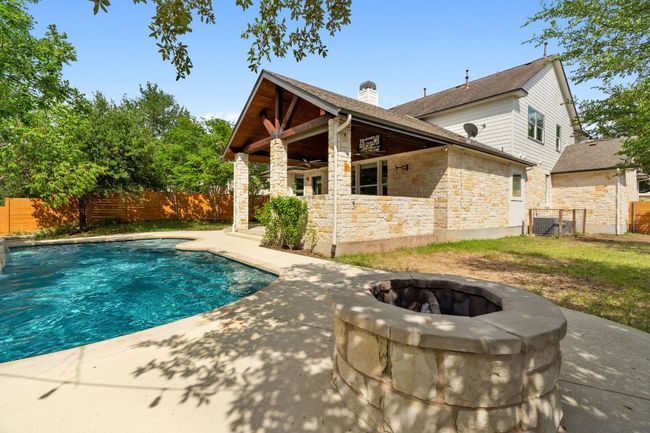 The backyard is surrounded by trees, creating much privacy. | Image 26