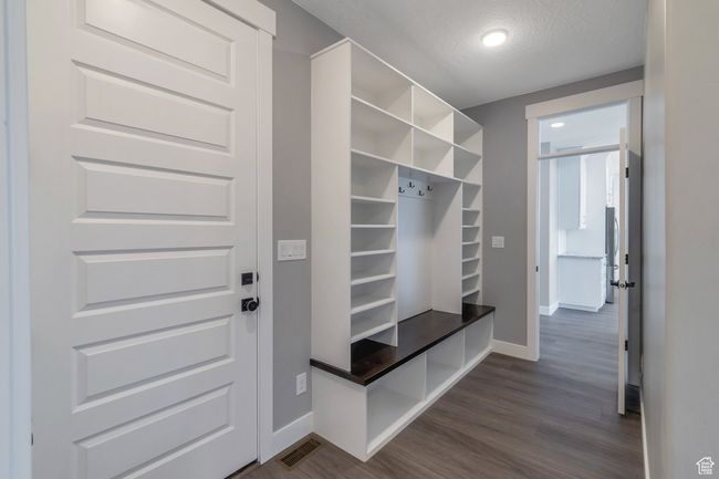 Mudroom with baseboards and dark wood finished floors | Image 15