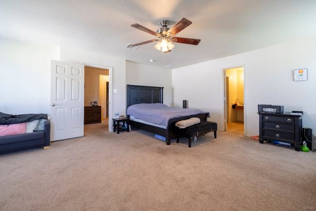 Bedroom featuring carpet flooring and a ceiling fan | Image 10