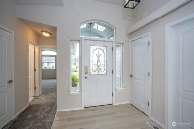 The entry welcomes you with an open and bright atmosphere, immediately reflecting the warmth and care that has gone into this beloved home. | Image 2