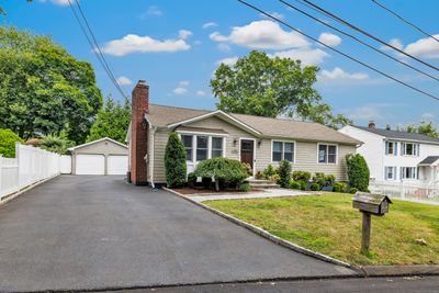 Spacious driveway with two-car garage. | Image 3