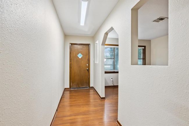 Foyer with vynil flooring and fresh paint throughout | Image 4