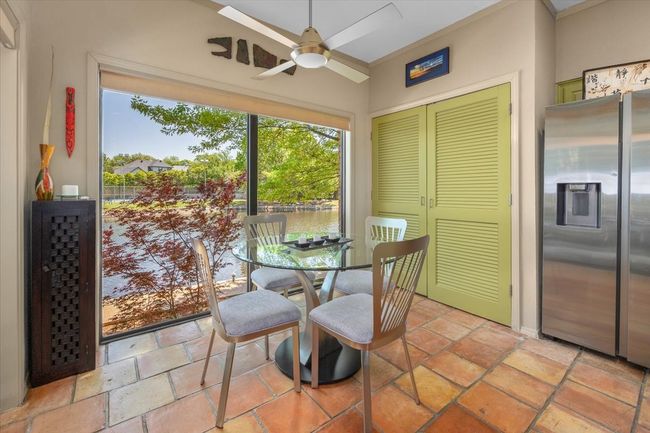 Breakfast room featuring a wealth of natural light, a ceiling fan, and Saltillo tile flooring | Image 22