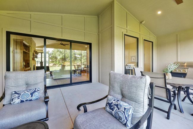 View of patio featuring ceiling fan | Image 33