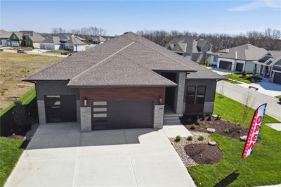 View of front of house with a front lawn and a garage | Image 3