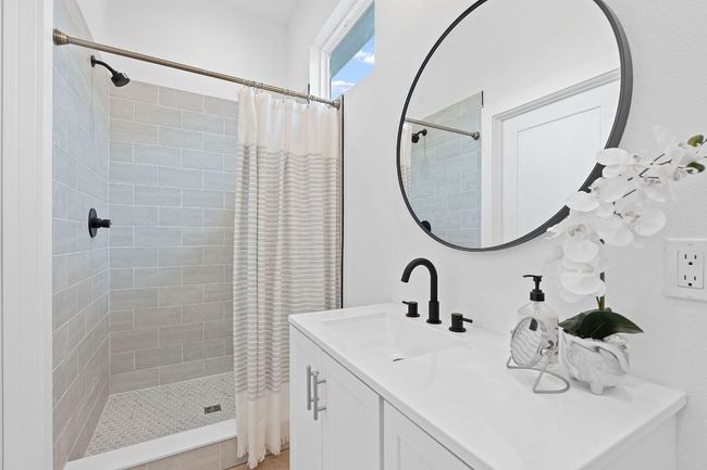Bathroom featuring vanity and a shower stall | Image 33