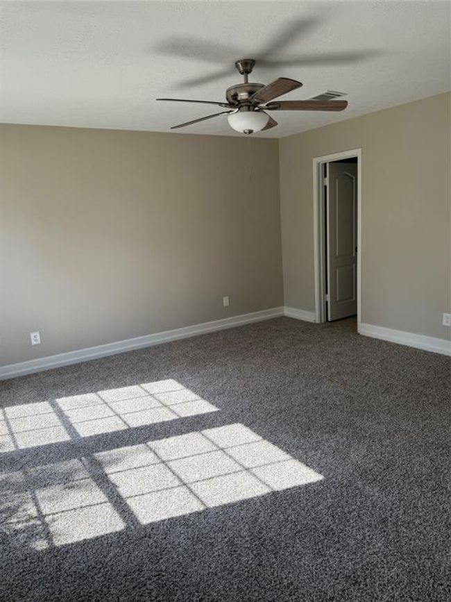 view of primary bedroom from entry downstairs | Image 7