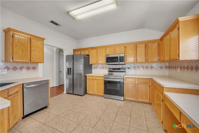Kitchen Cabinetry Galore! Dedicate Office nook in kitchen could also double as a huge coffee bar! Stainless steel appliance package | Image 12
