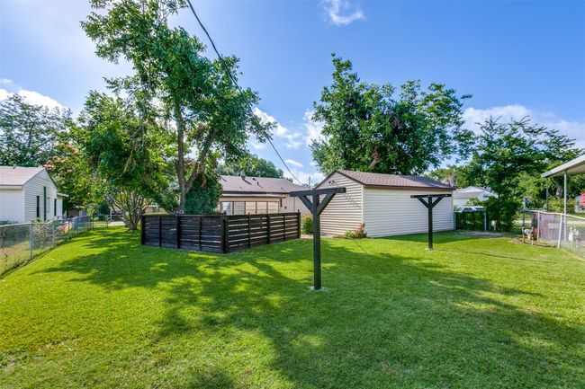 View of fenced backyard | Image 24