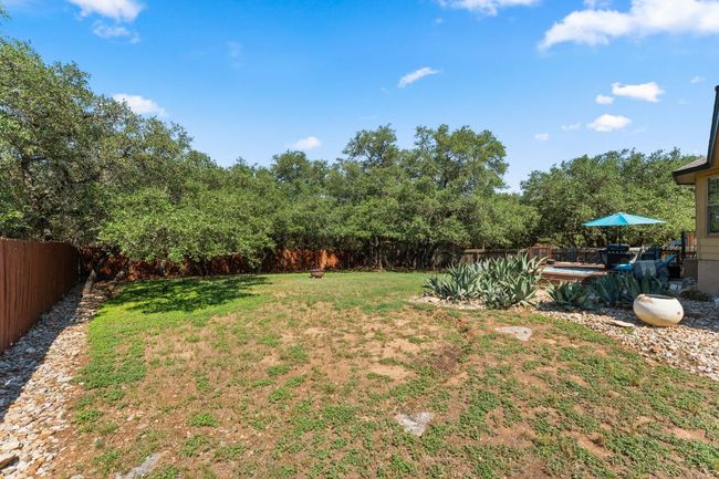 View of yard with a pool | Image 24