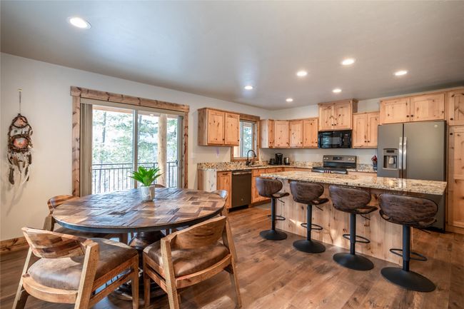 Dining area looking into Kitchen | Image 8