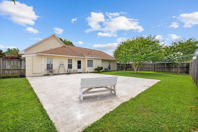 Back of house with a patio area, a fenced backyard, and roof with shingles | Image 16