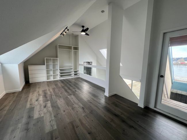 Bonus room with vaulted ceiling, dark wood finished floors, and a ceiling fan | Image 20