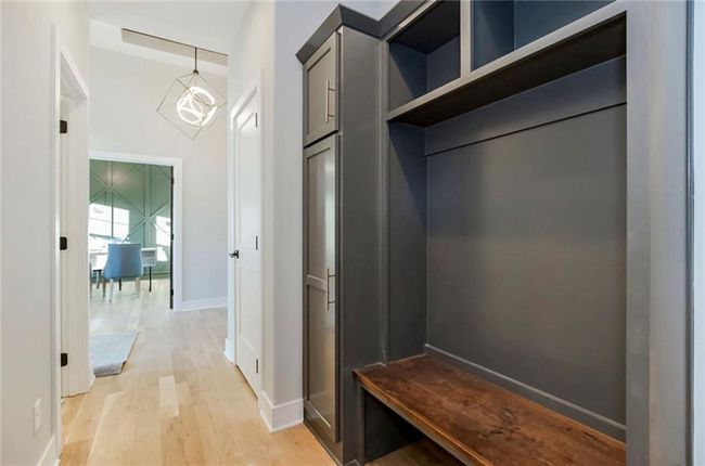 Mudroom with light wood-style floors and baseboards | Image 16