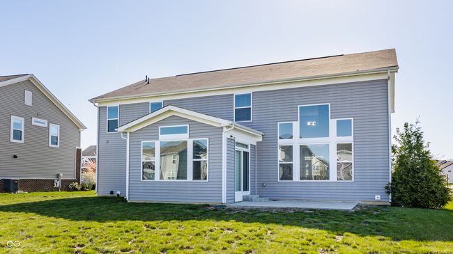 back of property with a yard and a patio | Image 45