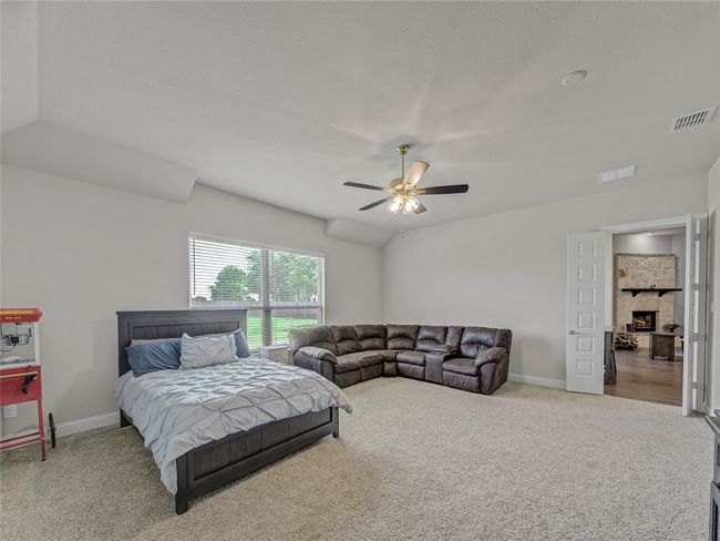 Bedroom with carpet floors and ceiling fan | Image 32