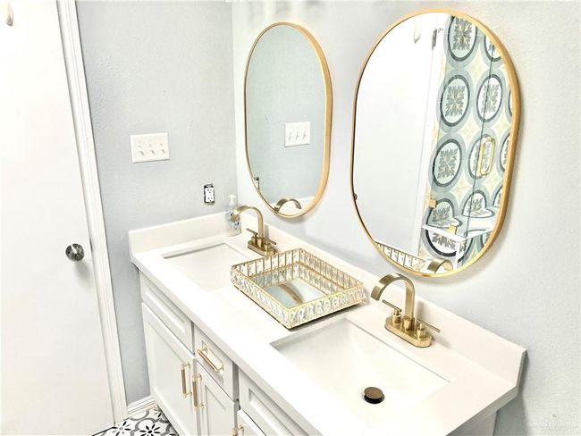 Bathroom featuring double vanity | Image 17