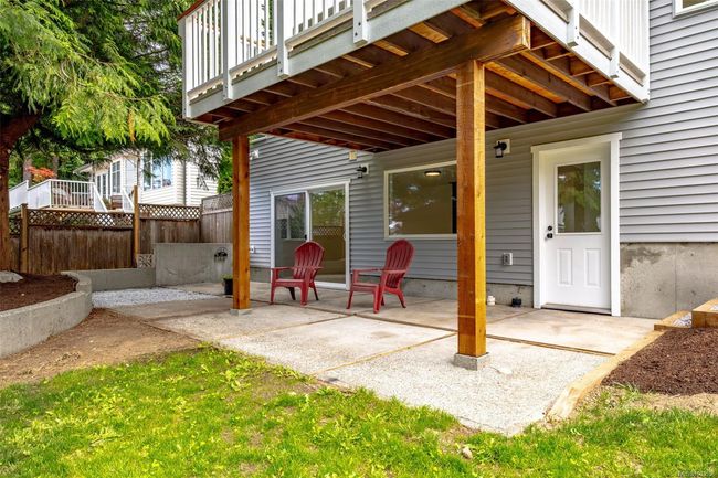 Covered downstairs entrance and patio space | Image 59
