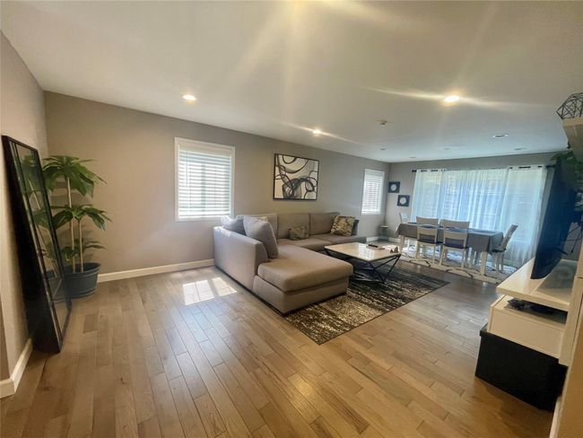 Living area with recessed lighting, light wood-type flooring | Image 7