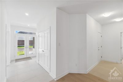 Foyer with double doors and upgraded tile floors | Image 2