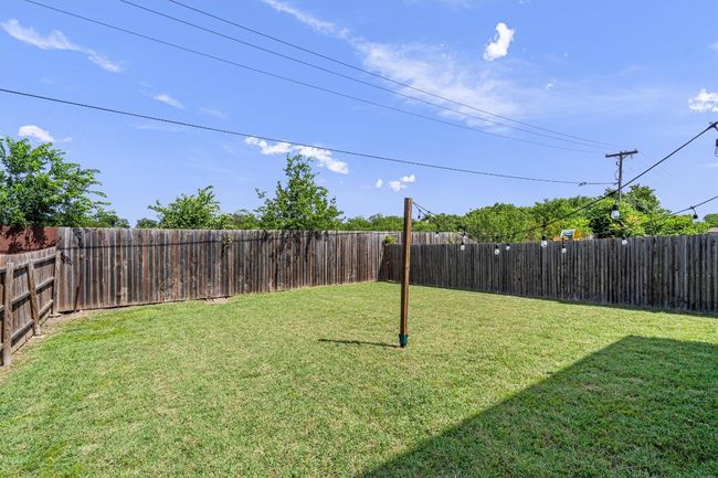 View of fenced backyard | Image 35