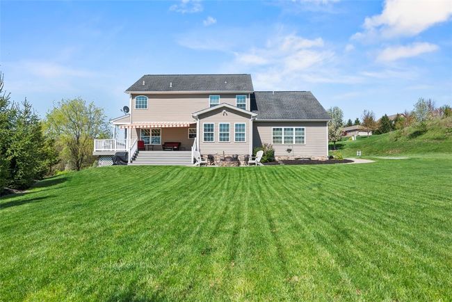 Have your friends over for some heated corn hole toss or put up that swing set for the kids on this level backyard. | Image 47