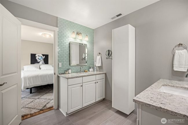 Primary bedroom bathroom with his/her vanities | Image 19