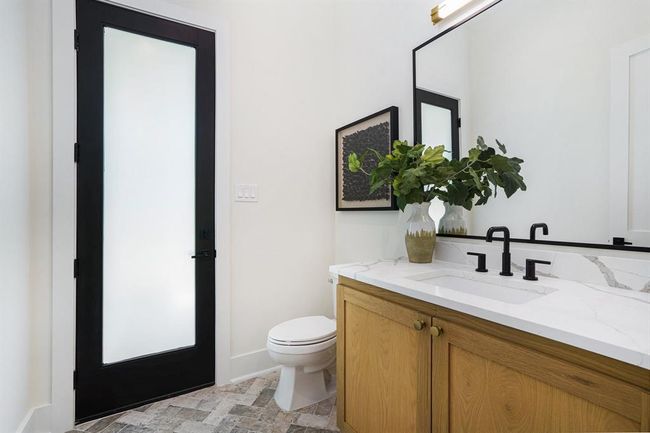 Powder room with exterior access. | Image 15
