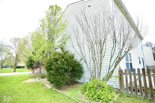 view of home's exterior featuring a yard and fence | Image 44