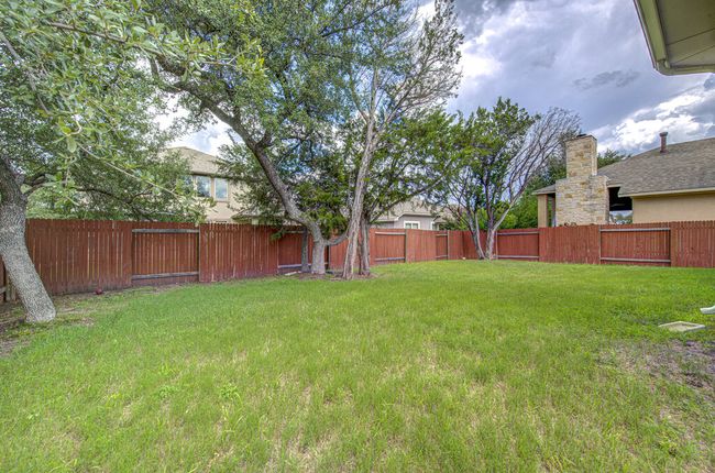 View of fenced backyard | Image 30