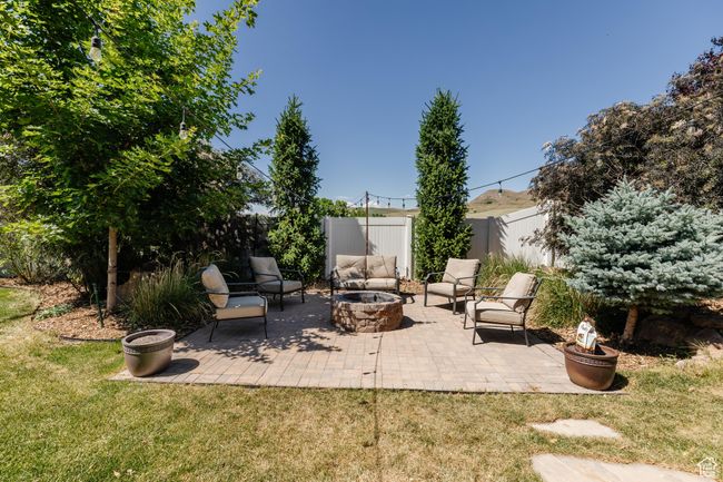 View of patio with a fire pit | Image 49