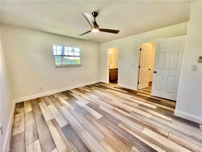 Primary bedroom with walk in closet and ensuite private bath. | Image 20