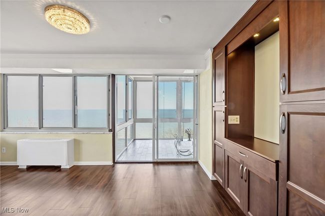 Entryway featuring a wealth of natural light, dark wood finished floors, and baseboards | Image 12