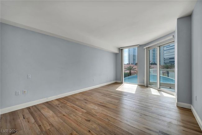 Primary suite with wood finished floors and baseboards | Image 33