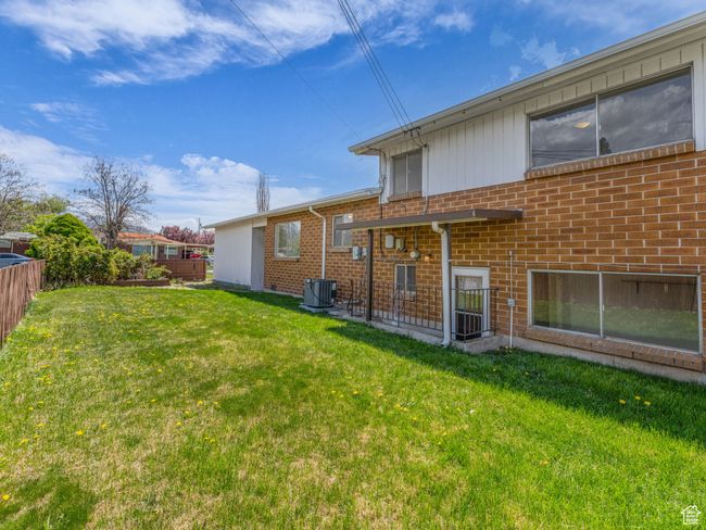 Rear view of property and walk out basement. | Image 23