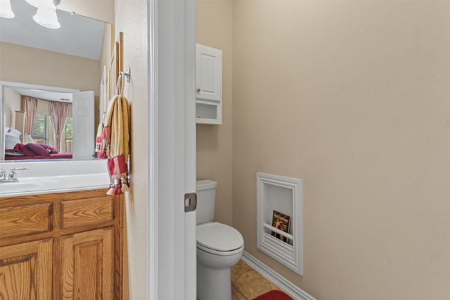 Bathroom with vanity, toilet, and tile patterned flooring | Image 20