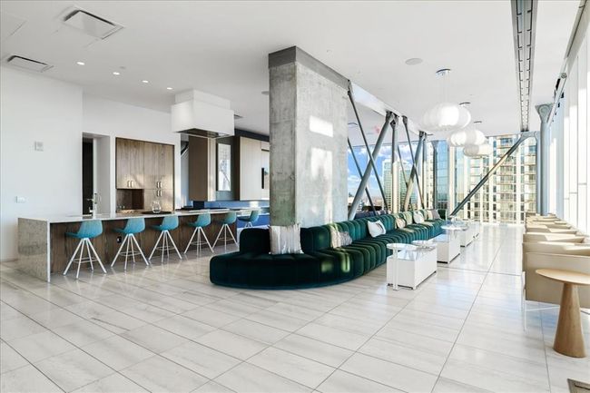 Amenity area for entertaining feat. Kitchen, dining, full gas range, TVs and expansive views. | Image 28