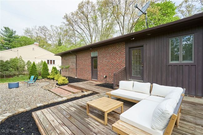 Wooden deck featuring an outdoor hangout area | Image 25