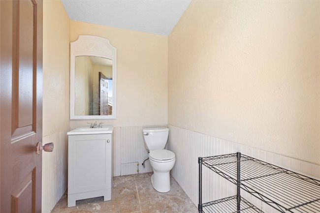 Half bathroom with toilet and sink outside for pool guests | Image 35