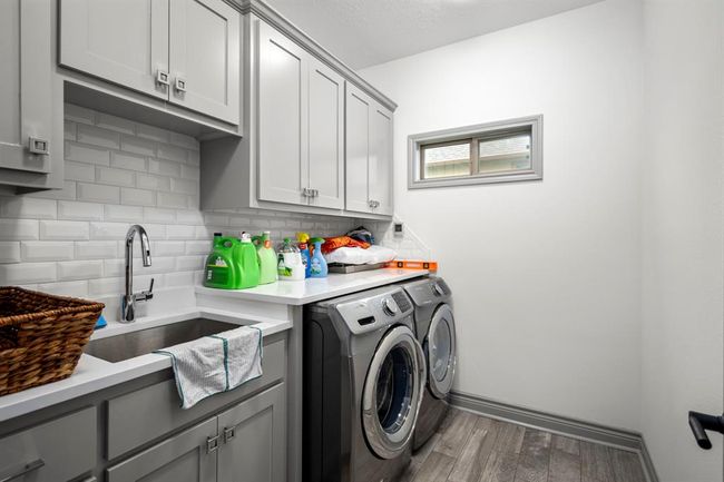 Laundry Room offers sink, folding counter & W/D can be included. | Image 14