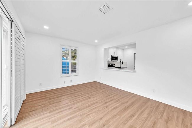 Family Room with Pass-Through Bar to Kitchen | Image 16