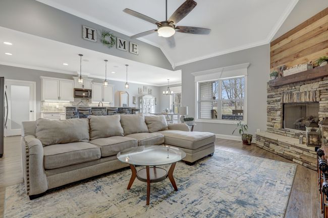 Open floor plan connecting the living room, kitchen and dining room | Image 4
