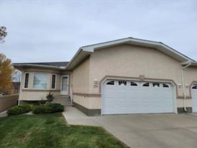 3045 Fairway St S, Home with 2 bedrooms, 3 bathrooms and 4 parking in Lethbridge AB | Image 1