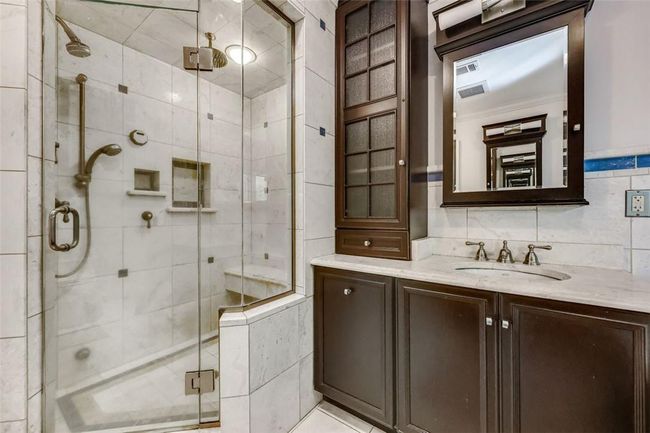 Bathroom featuring steam shower. | Image 19